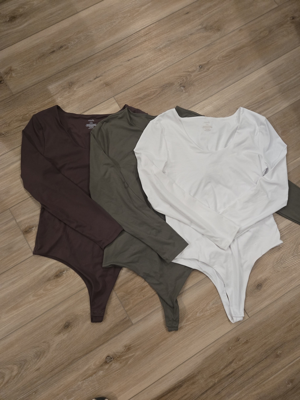 nuuds Long-Sleeve Bodysuit Trio in White, Olive, and Brown